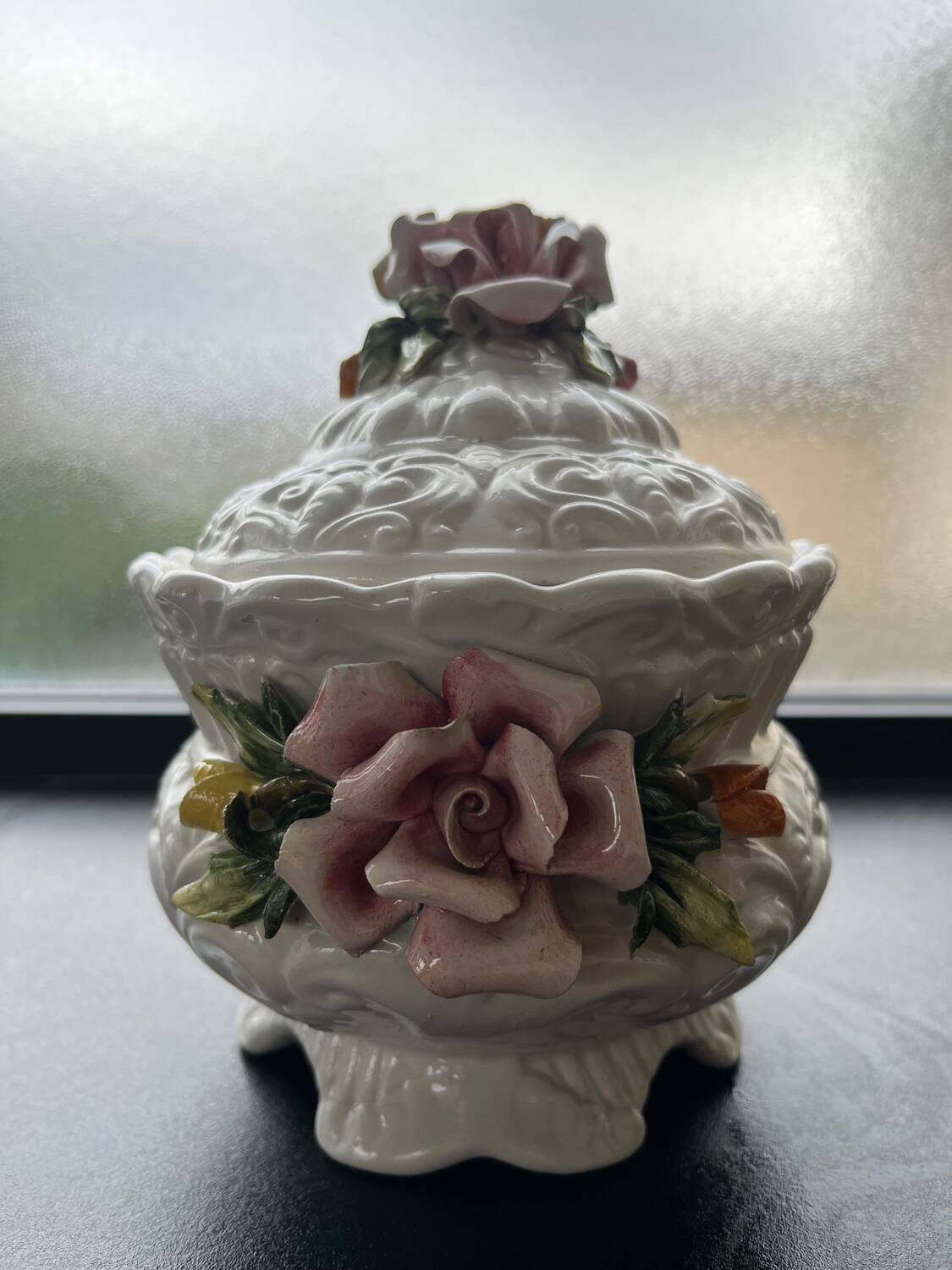 Capodimonte-style porcelain lidded sugar bowl with floral relief
