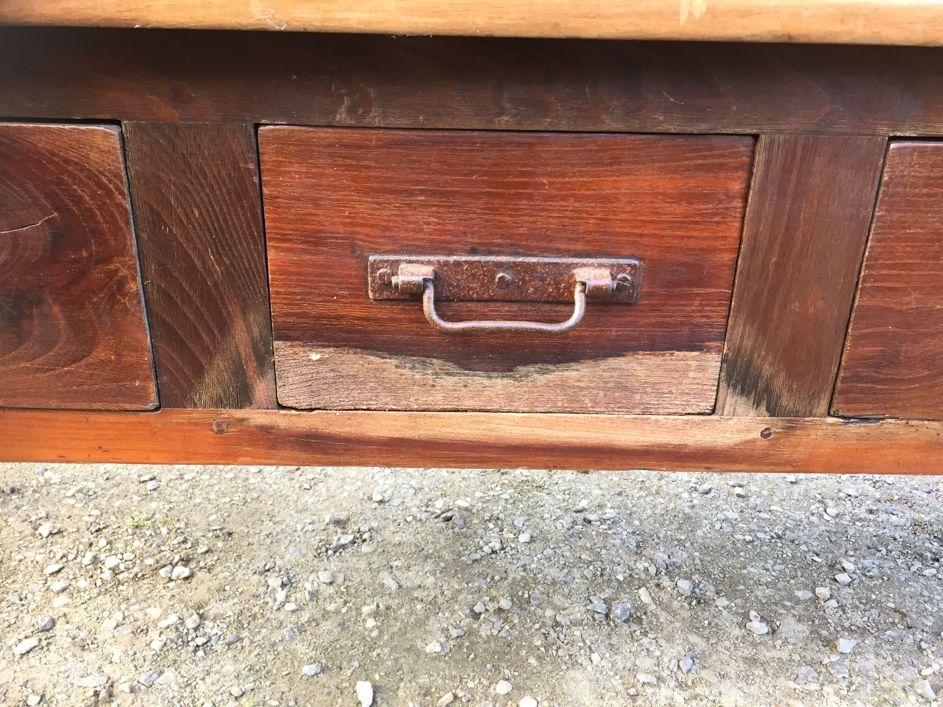 Old farmhouse table with cherry and chestnut panels with 3 drawers.