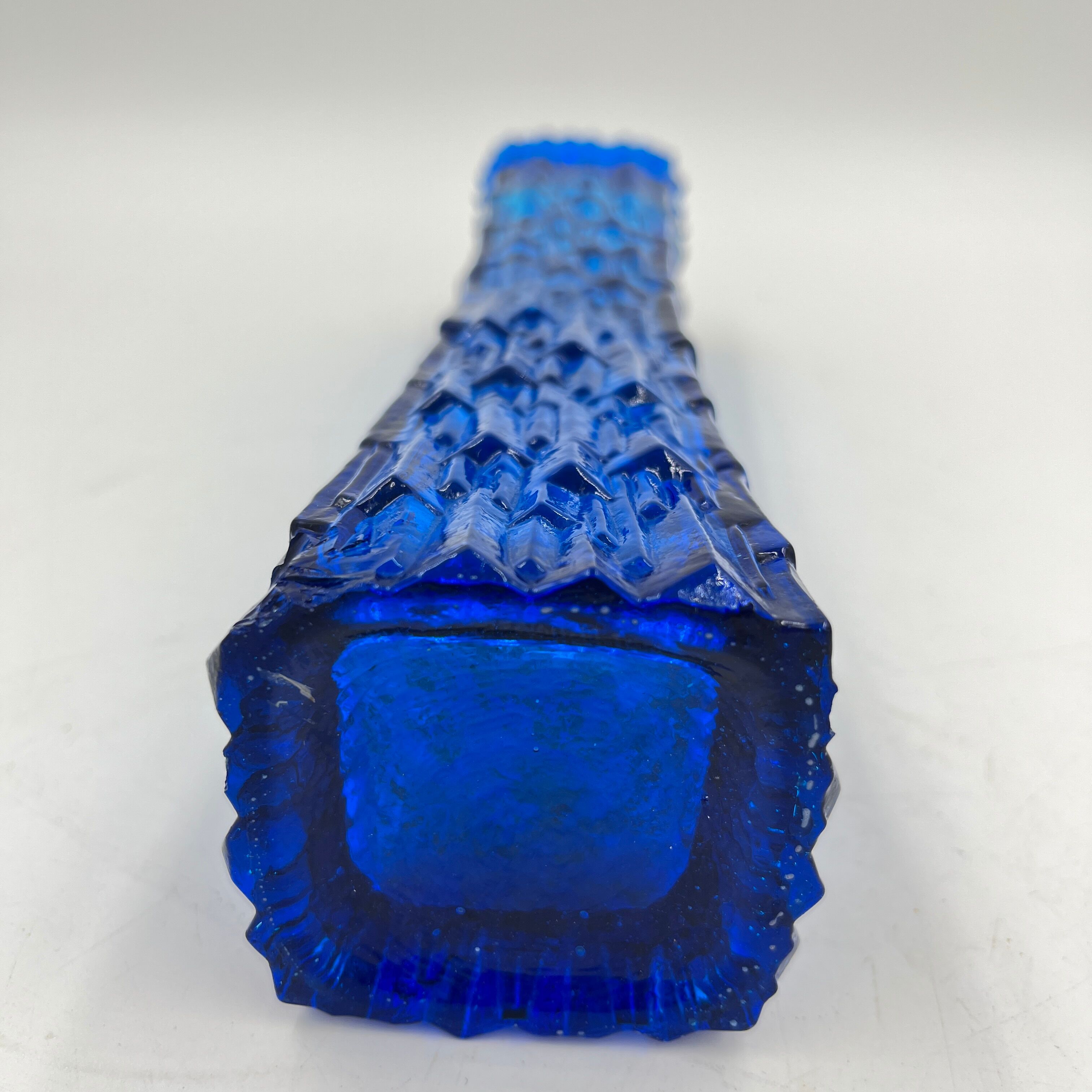 Blue glass vase with relief