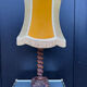 Sculpted wooden lamp with faces, antique.
