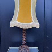 Sculpted wooden lamp with faces, antique.