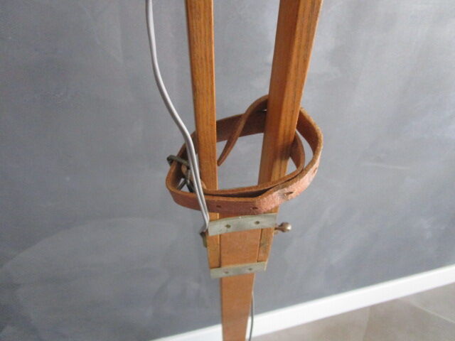 Old floor lamp on surveyor tripod
