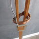 Old floor lamp on surveyor tripod