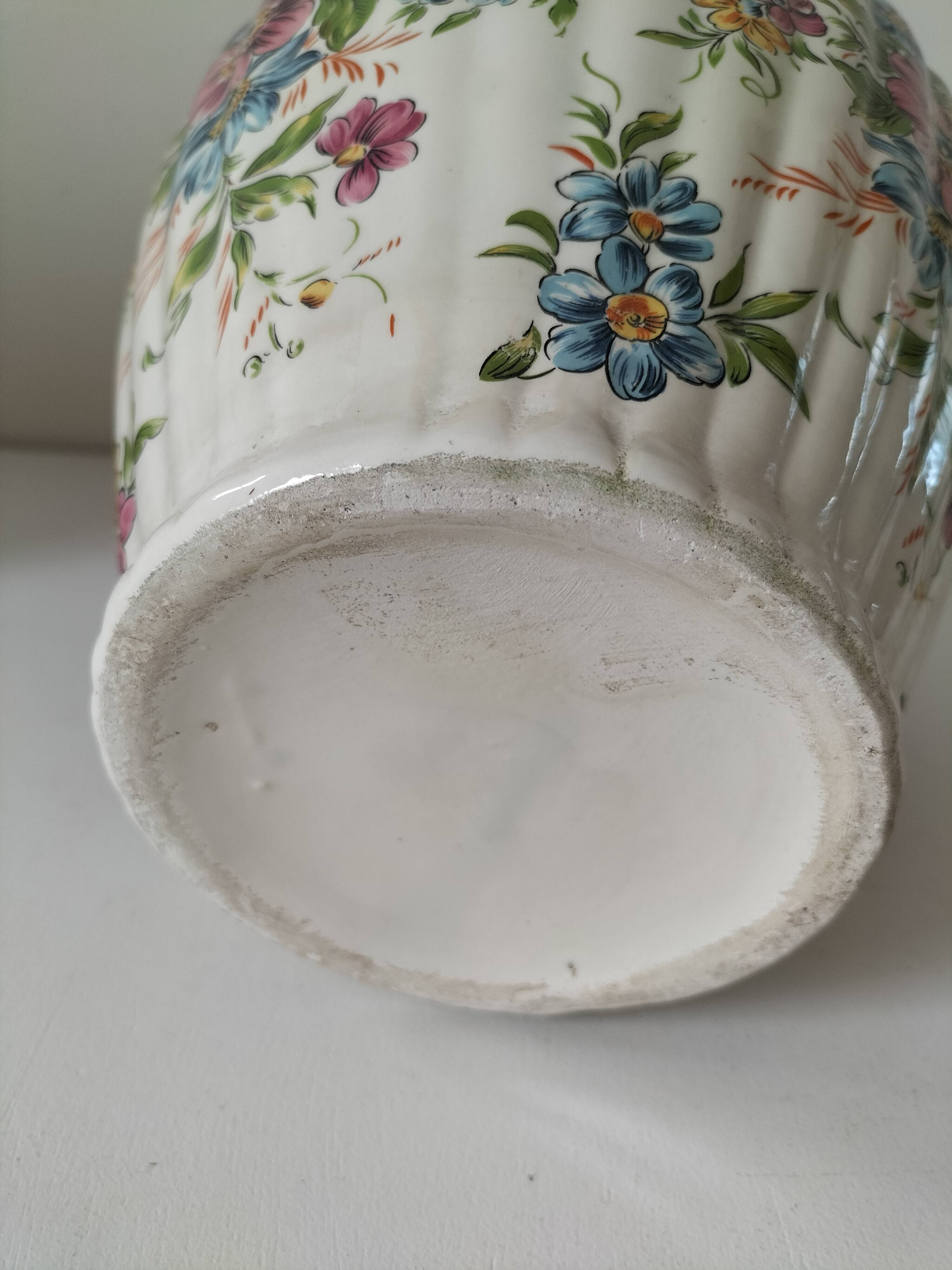 Antique vase with floral decoration in enamelled earthenware – timeless charm