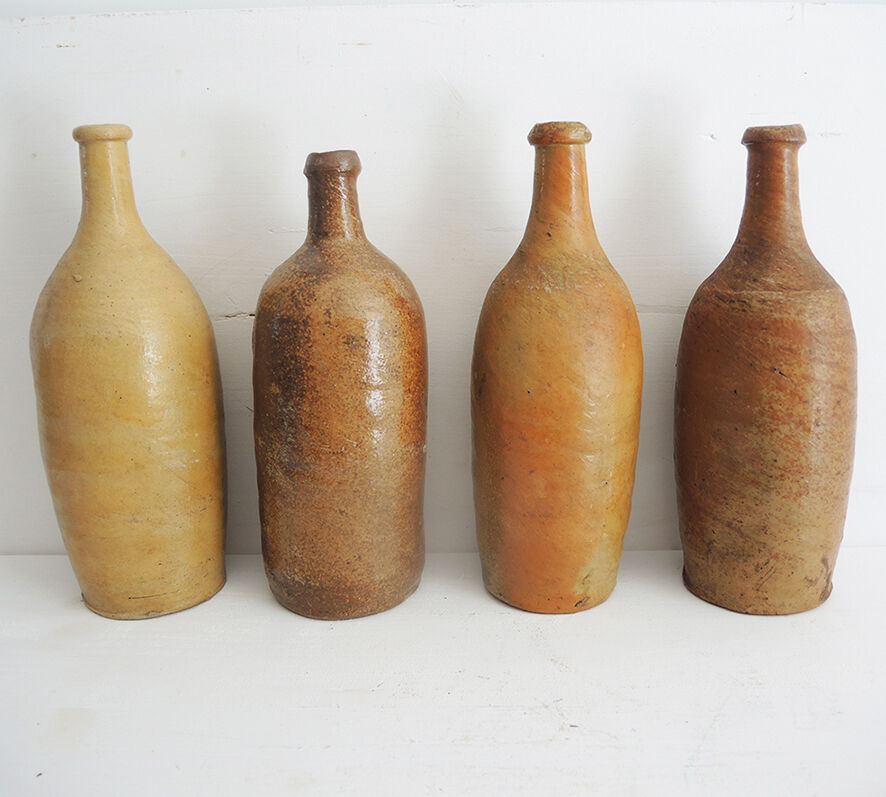4 old stoneware bottles
