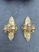 Pair of bronze wall sconces with mask, signed L. Pinet, Art Nouveau period.