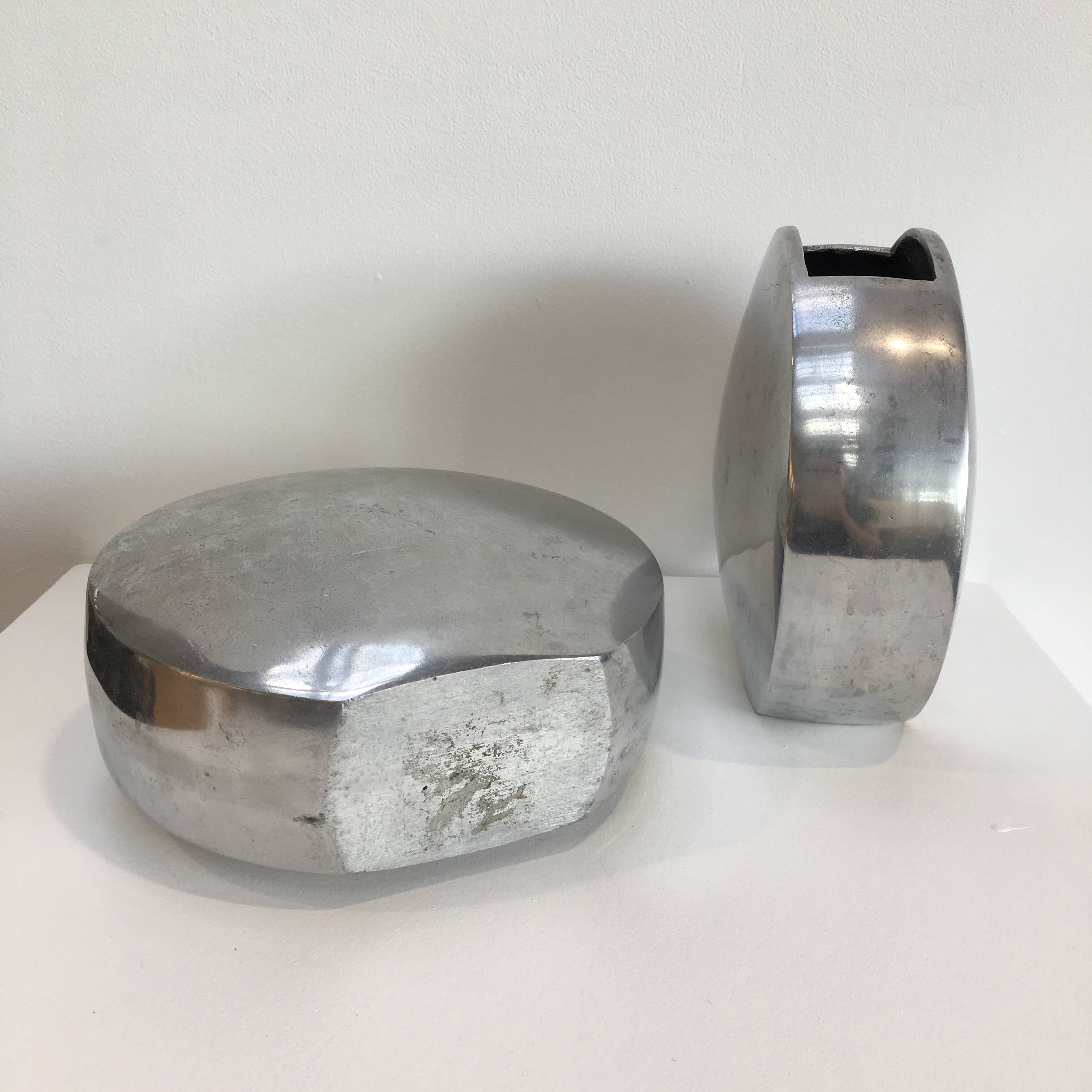 Series of two 70s style aluminum vases