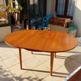 Round extendable teak dining table from the 60s