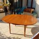 Round extendable teak dining table from the 60s