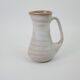 Signed white beige ceramic pitcher