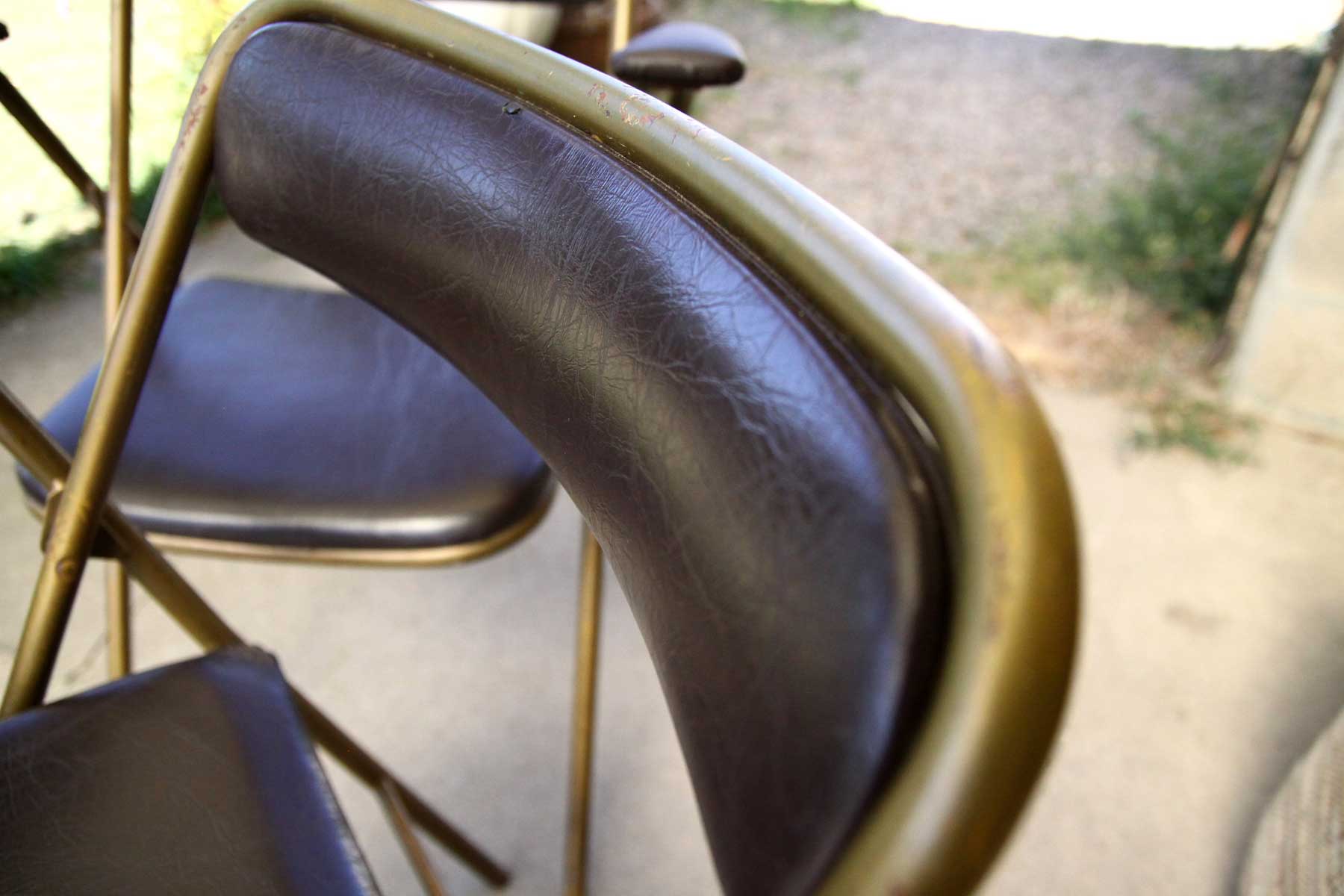 Lot of 4 metal and skai folding chairs