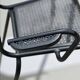 Set of 6 armchairs and perforated metal table from the 1950s.