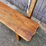 Brutalist bench with dark wood backrest