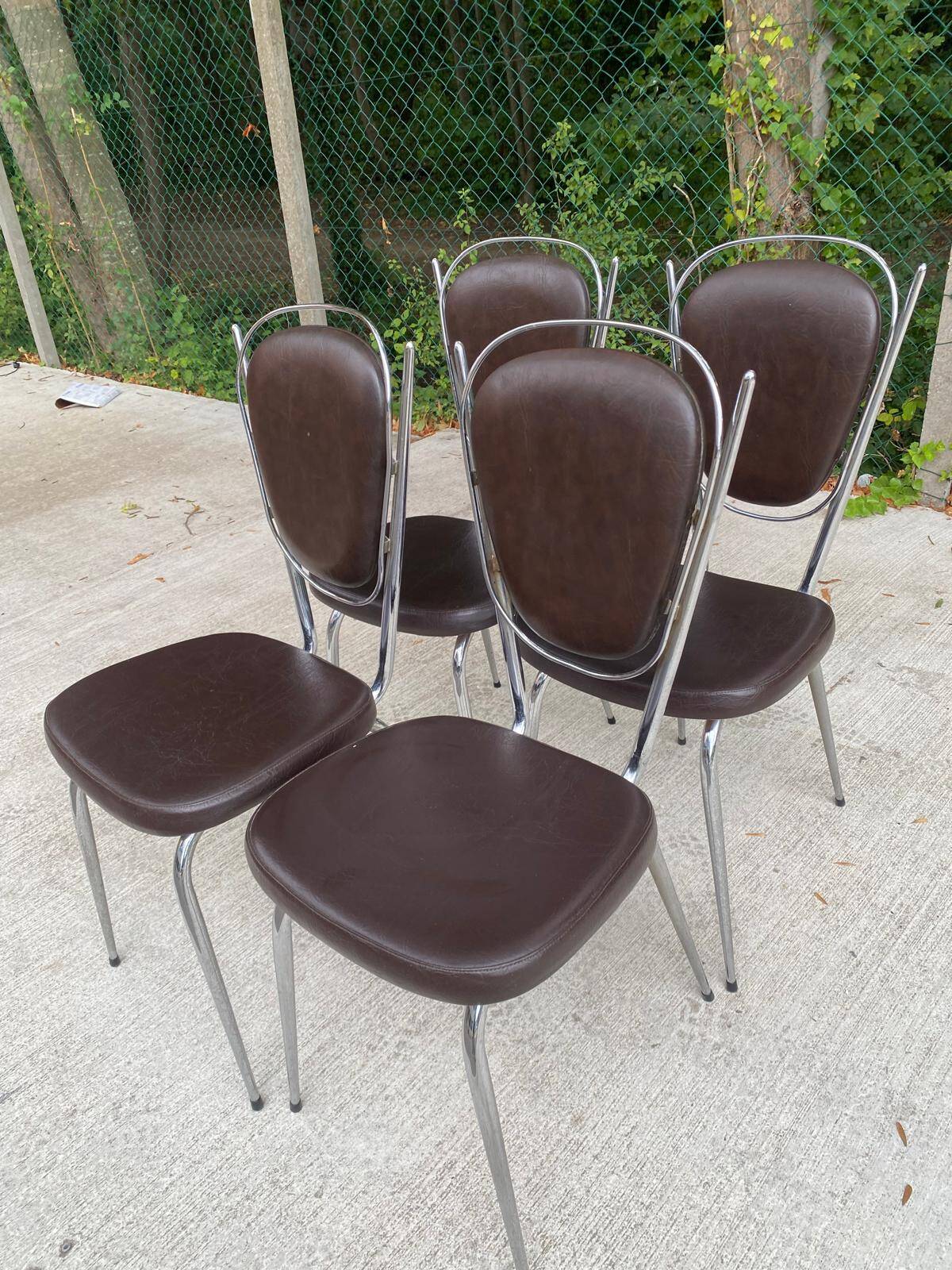 Set of 4 vintage chairs from the 60s/70s in brown faux leather with chrome compass legs.