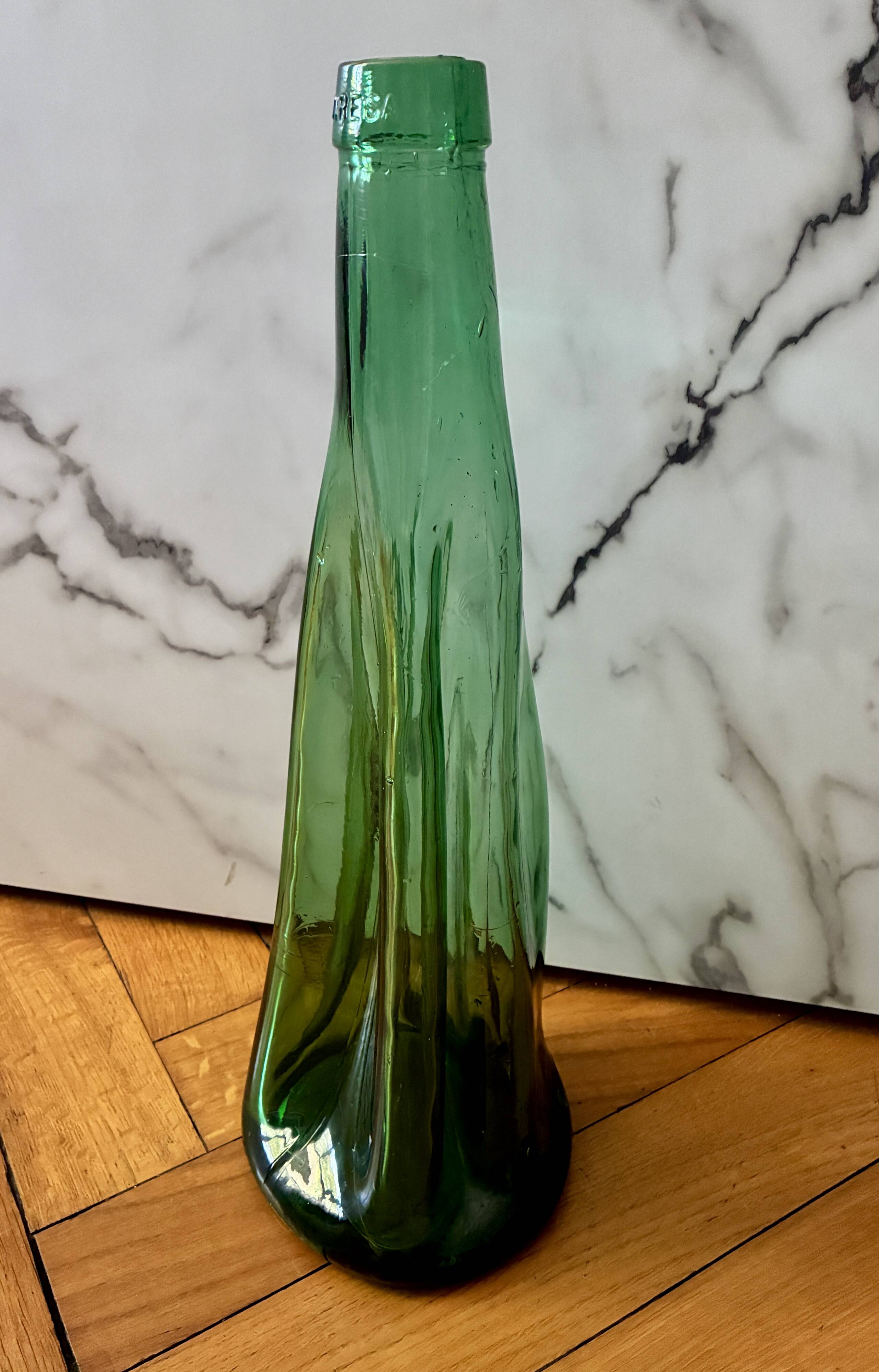 Vintage Viresa bottle in a flattened shape.