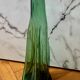 Vintage Viresa bottle in a flattened shape.