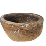 A substantial hand-hewn wooden bowl carved from a single burl section