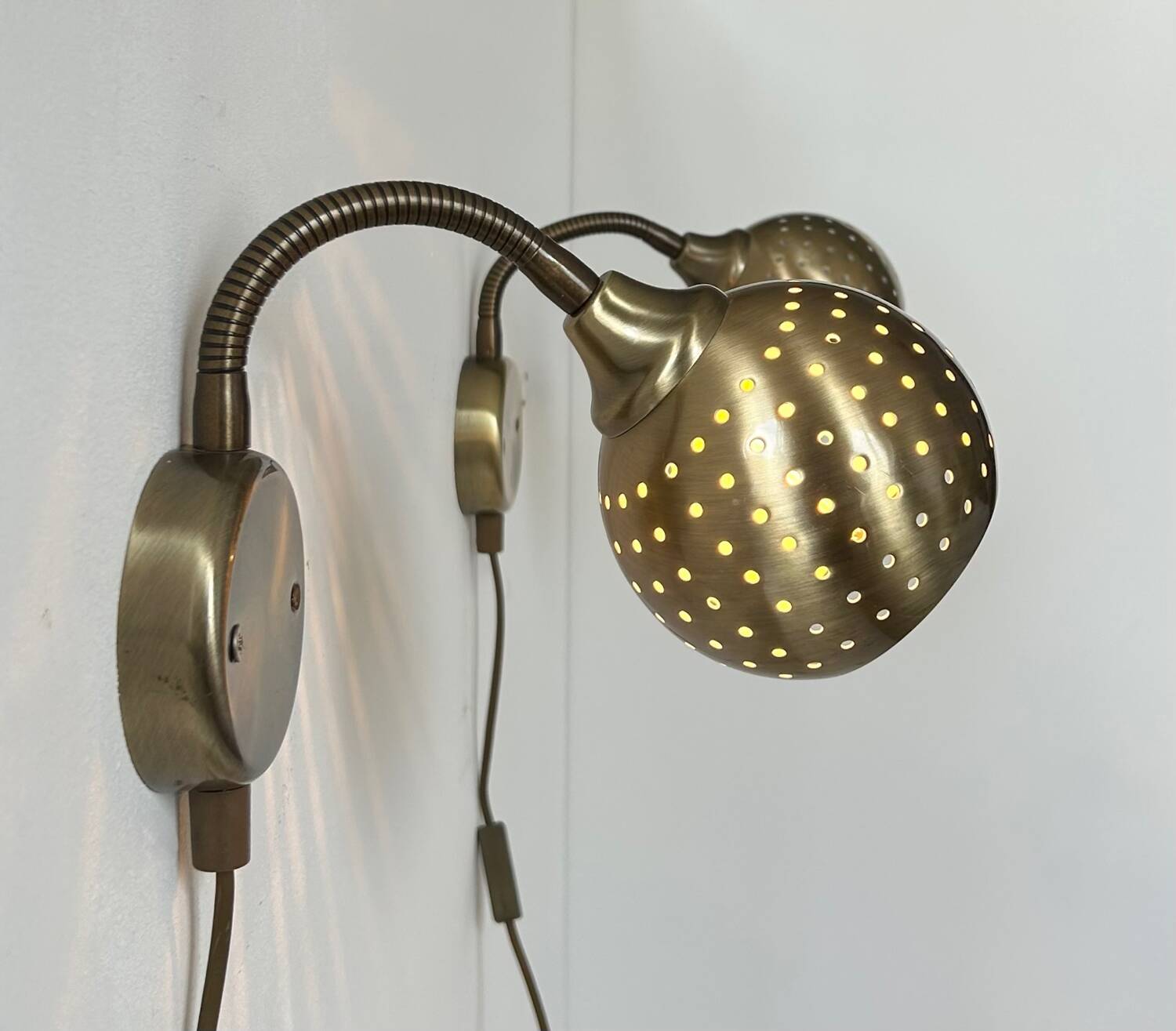 Pair of vintage adjustable wall lights, perforated brass, Sweden 1960