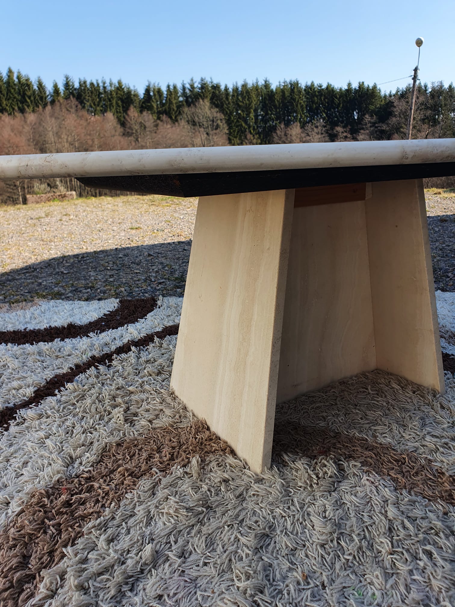 Oval travertine coffee table