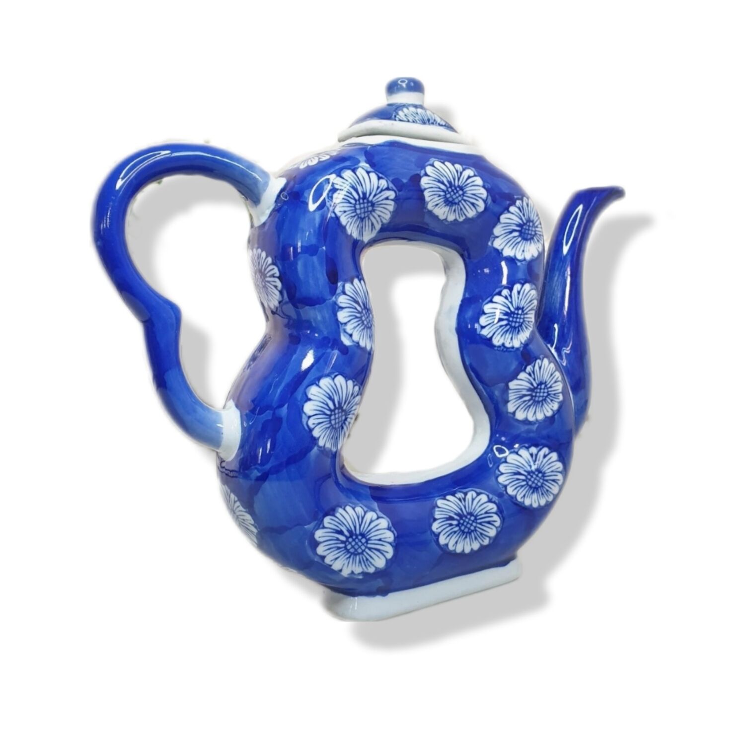 Old Asian teapot in toroidal shape in blue porcelain with floral decoration 20th century