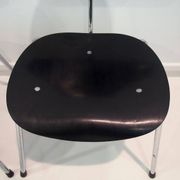 Set of four Egon Eiermann model SE 68 chairs in black lacquered plywood and steel.