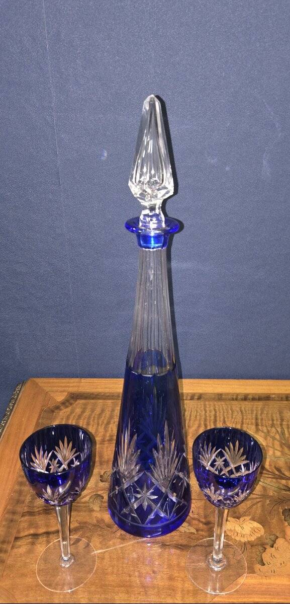 Cobalt blue double crystal service, consisting of a decanter and two matching glasses.
