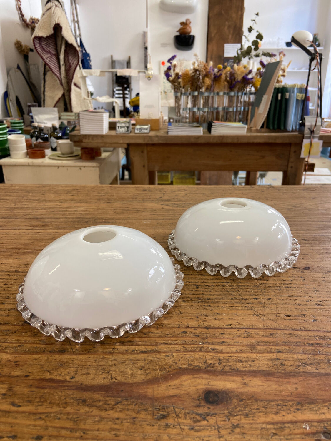 Pair of white glass pendant lights