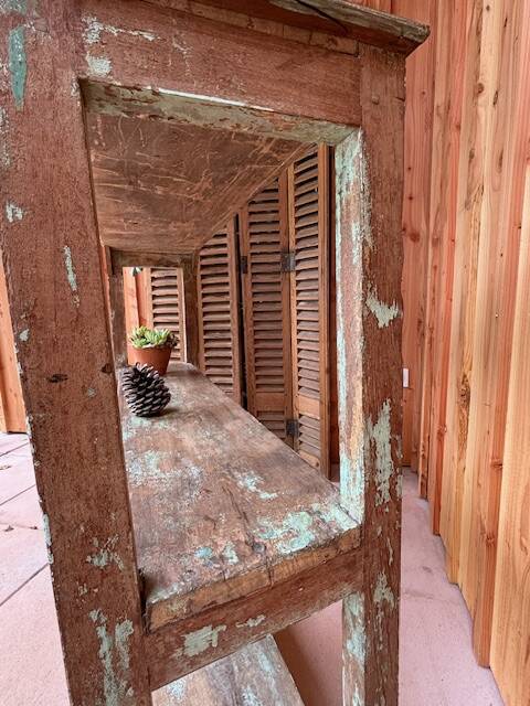 Teak shelves with a green patina