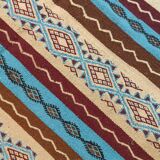 Multicolored hand-woven Berber rugs in natural wool