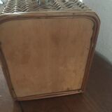Bagged suitcase in braided wicker and wood