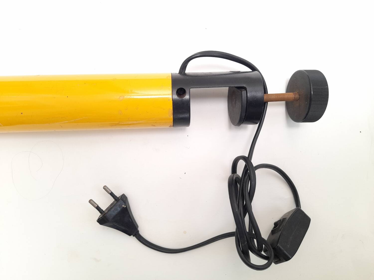 Bright yellow tubular desk lamp from the 80s