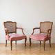 Pair of antique Louis XV armchairs in wood, caning and pink velvet.
