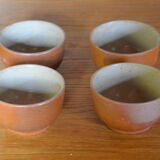 Lot of 4 bowls in sandstone and shiny grey inside