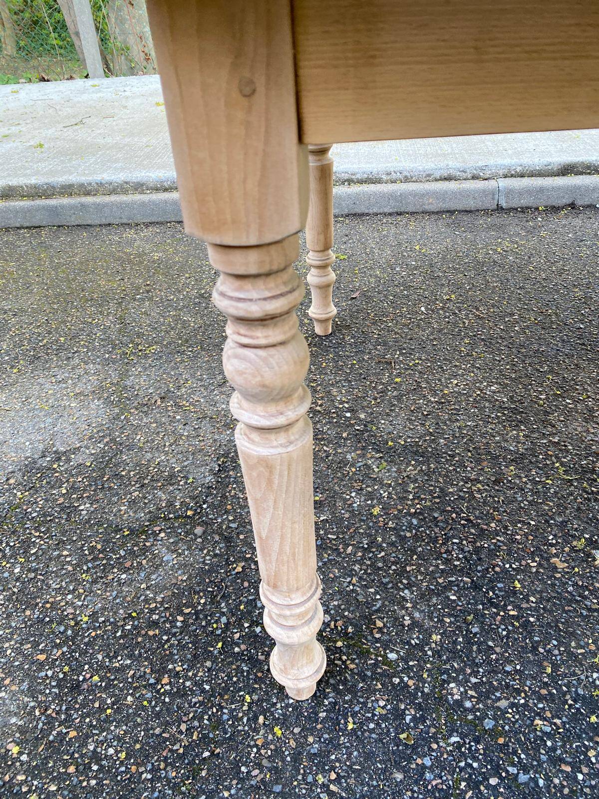 Renovated Louis Philippe round extendable dining table with 4 leaves.