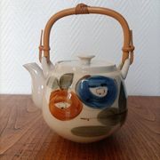 Asian style teapot with bamboo handle
