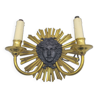 Bronze wall lamp. Sun and feminine mask. Louis XIV style.