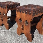Pair of brutalist stools, leather seat.