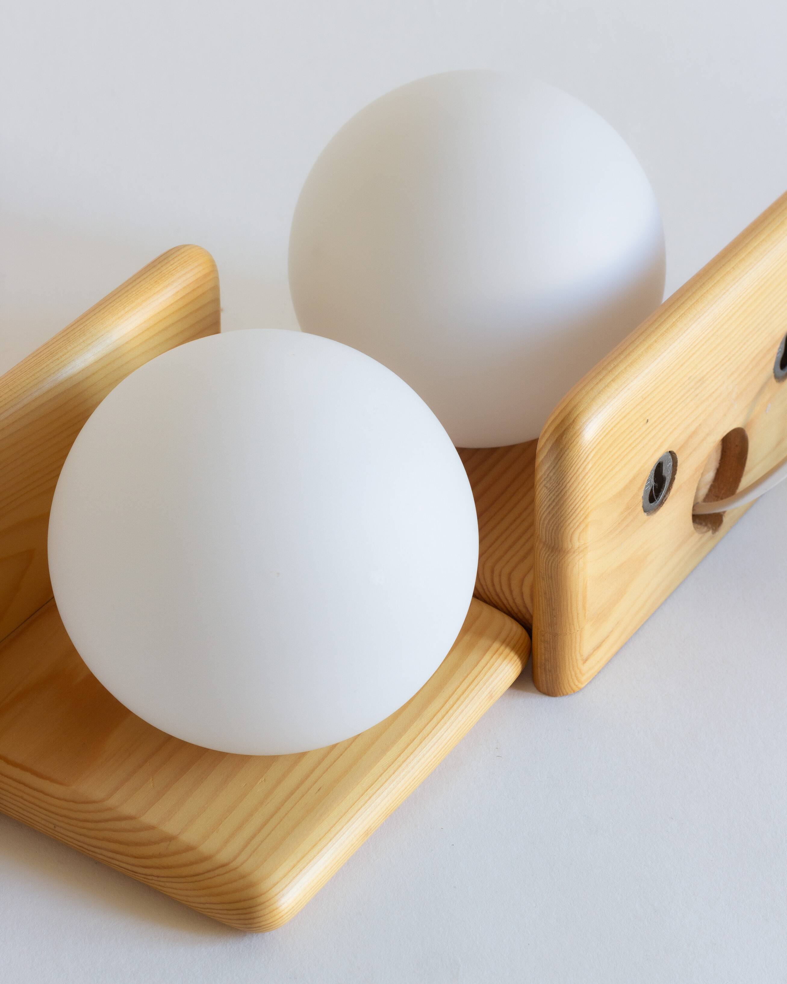Duo of pine and opaline glass wall lights, 1980s