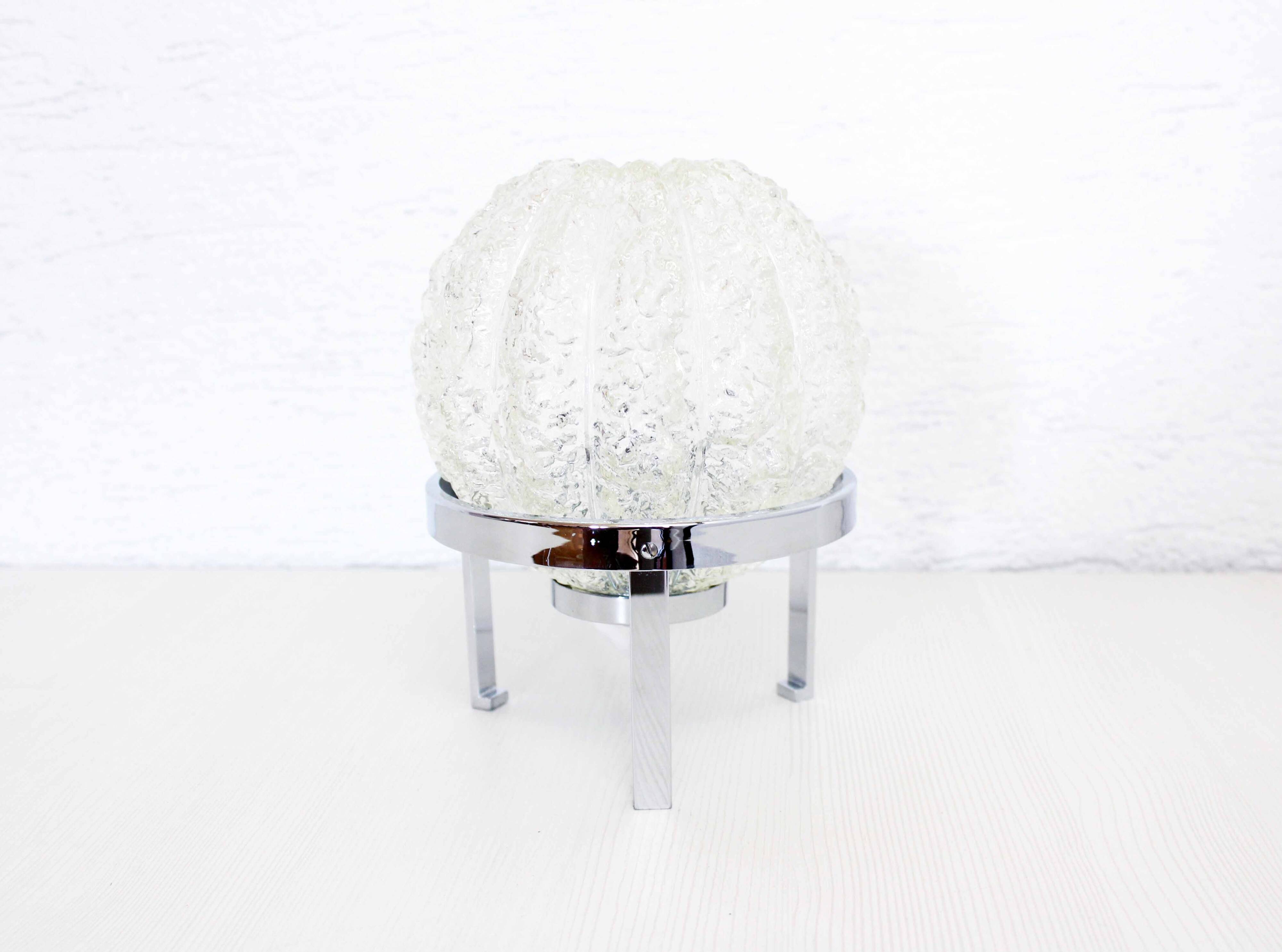 Glass ball on a chrome metal base