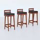 Erik Buck set of three bar stools in teak and leather Dyrlund Denmark 1960