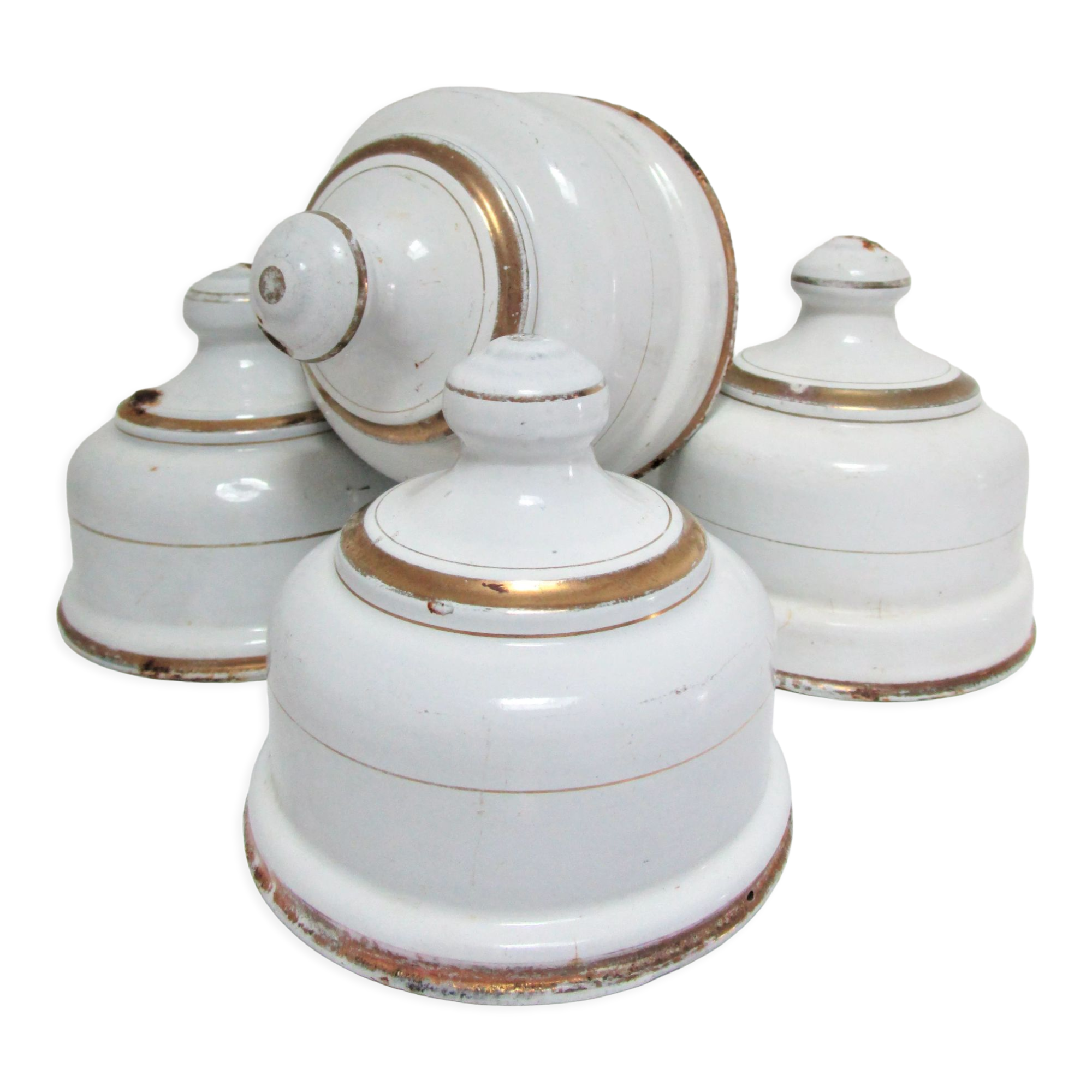 Four white enamelled metal cheese bells early twentieth century