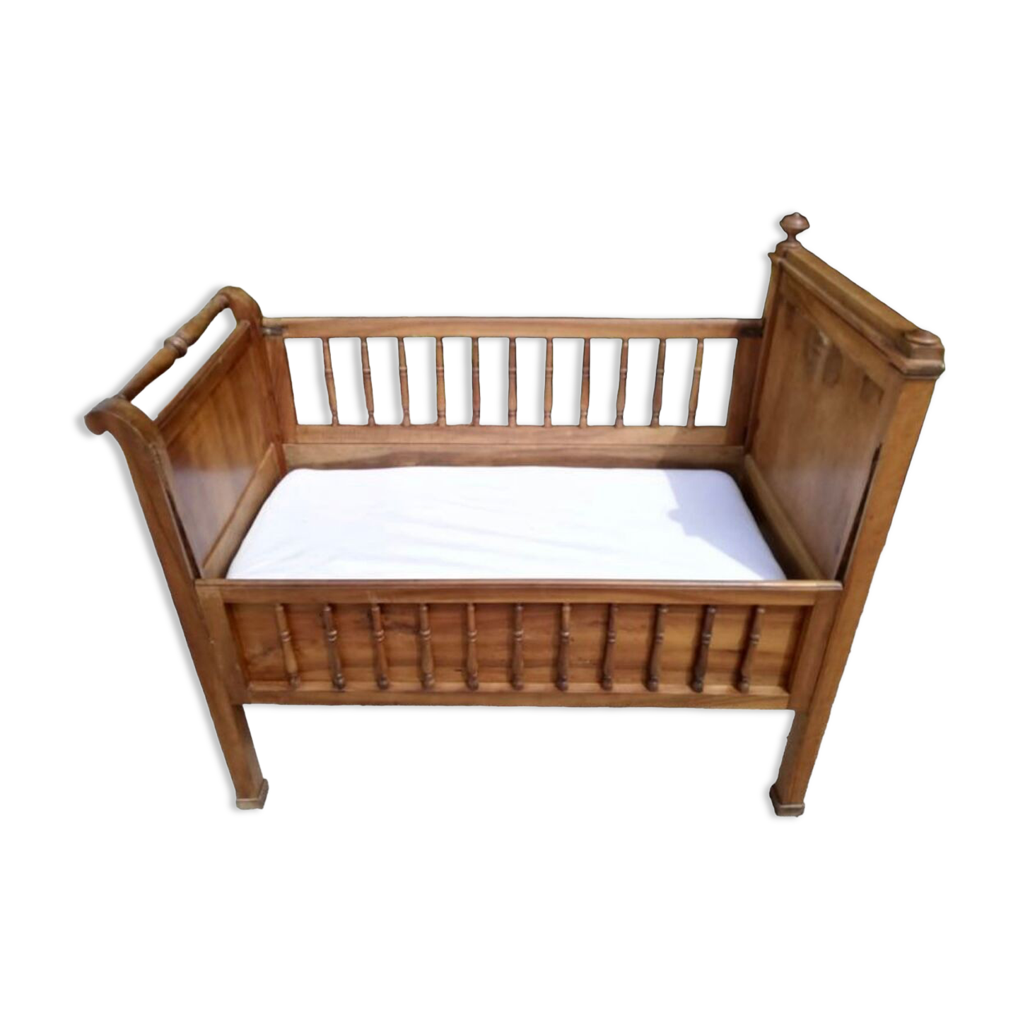 Old children's bed with retractable walnut bars