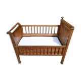 Old children's bed with retractable walnut bars
