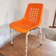 Chair with openwork plastic shell 1970
