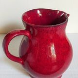 Vintage red enamel ceramic pitcher
