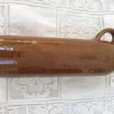 Old bottle in sandstone glossy with cove