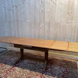Oak dining table with integrated extensions