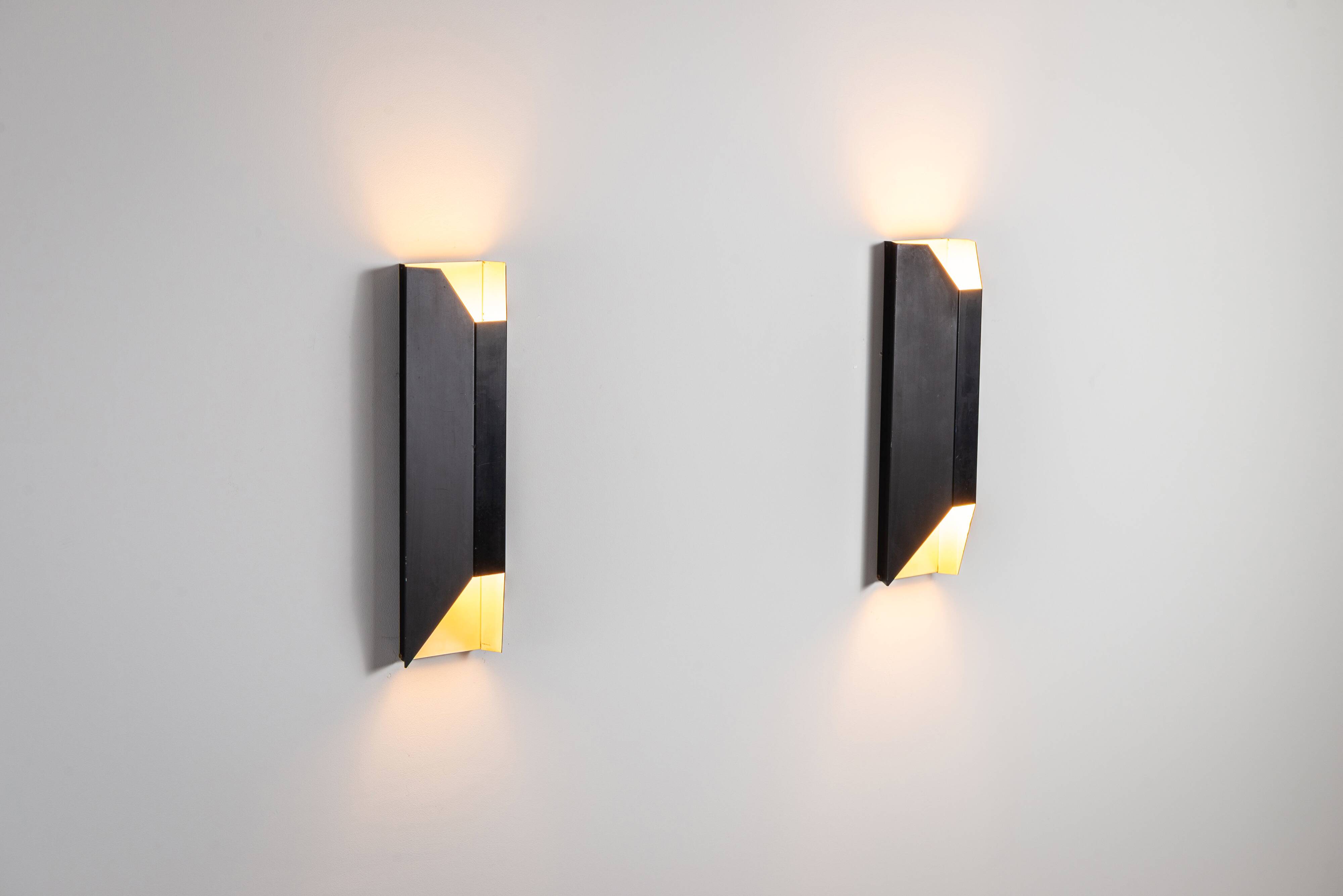 Architectural pair of vintage black metal wall lamps with angular geometric