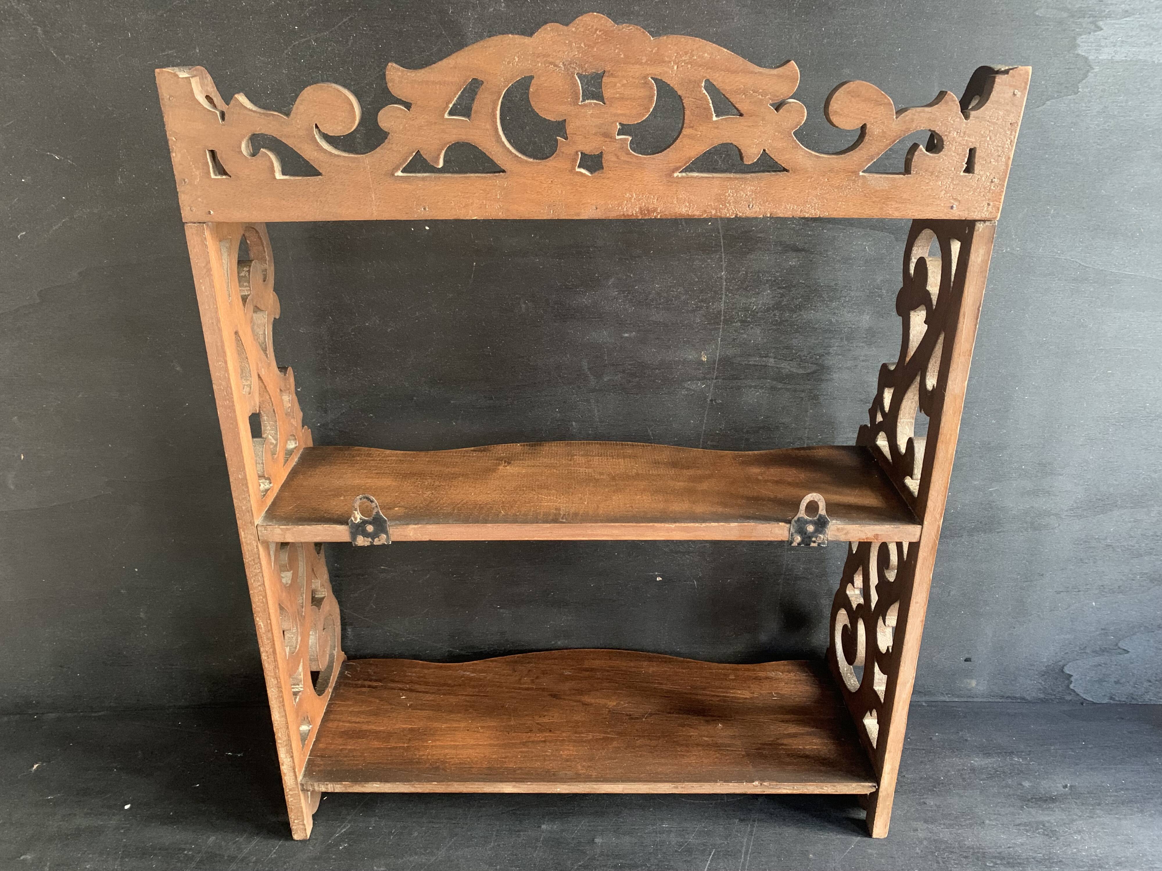 Antique shelf with openwork wooden pediment, early 20th century