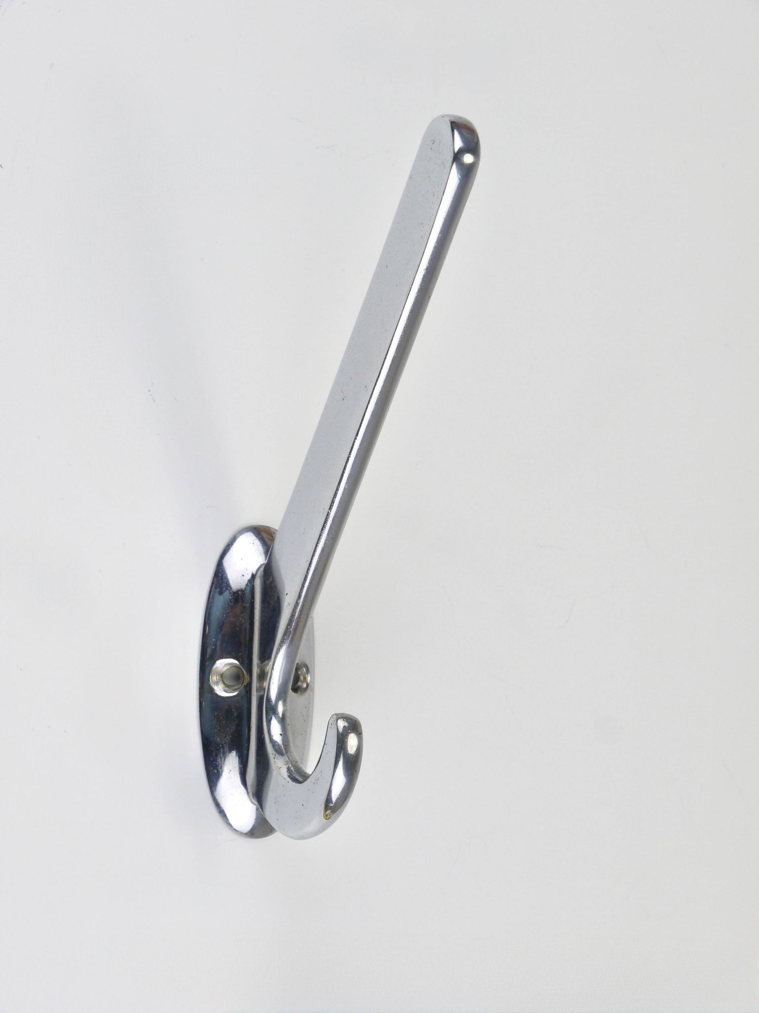 Up to 5 large Art Deco Bauhaus wall hooks in nickel and brass, Vienna, 1930s.